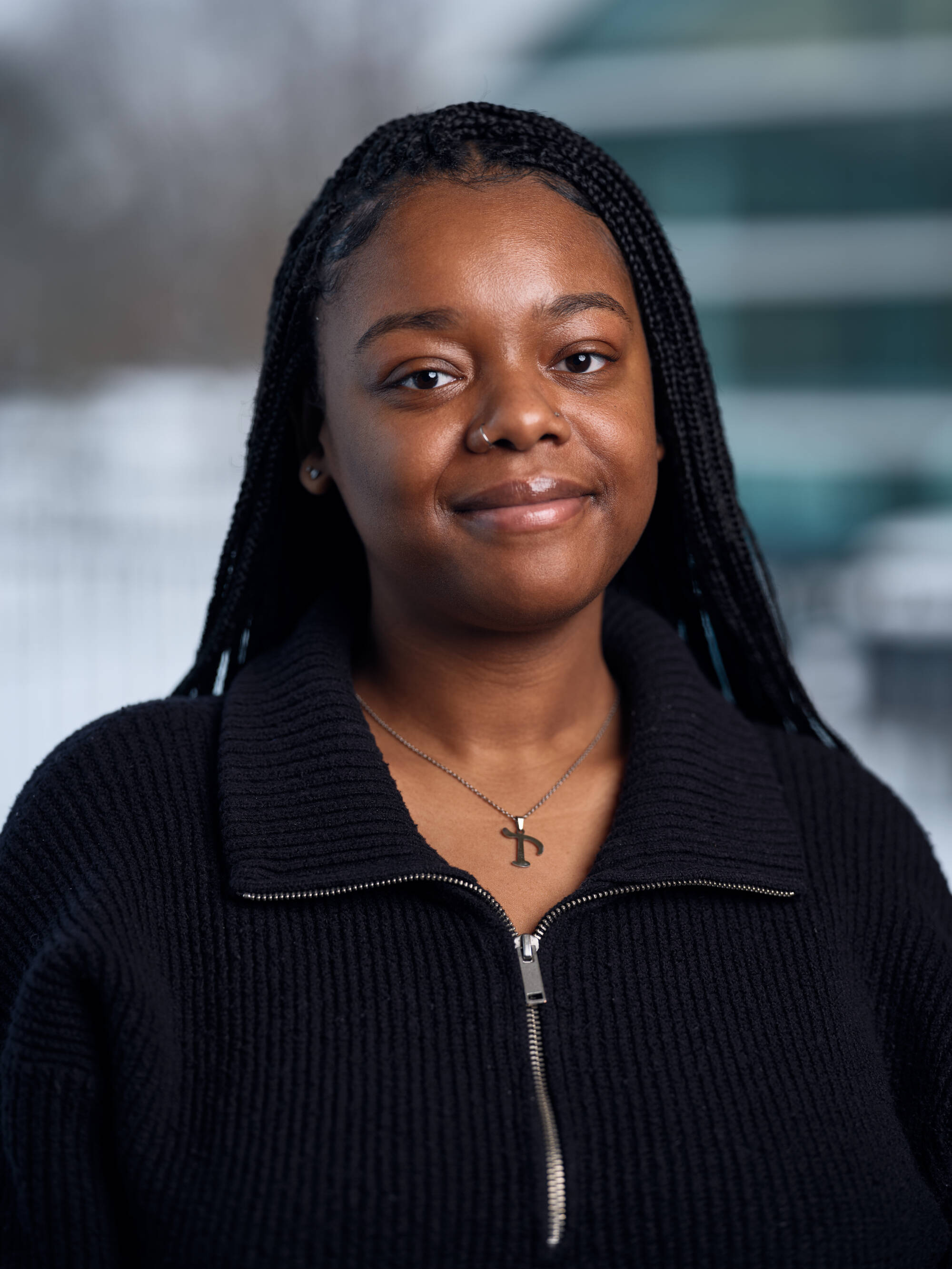 An individual smiling at the camera.